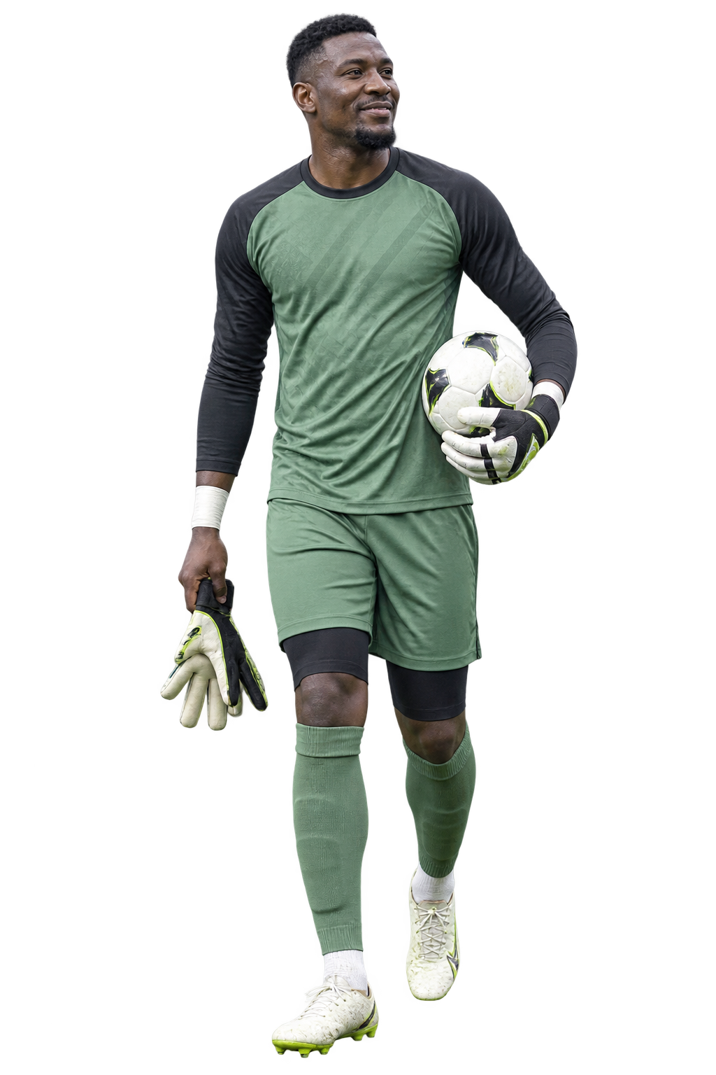 Goalkeeper holding a football and gloves after a match
